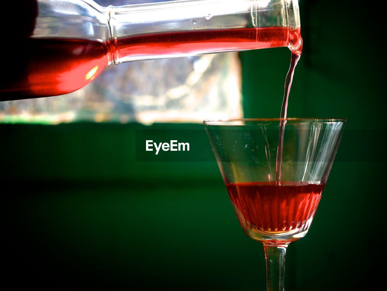 CLOSE-UP OF WINEGLASS IN GLASS OF WINE