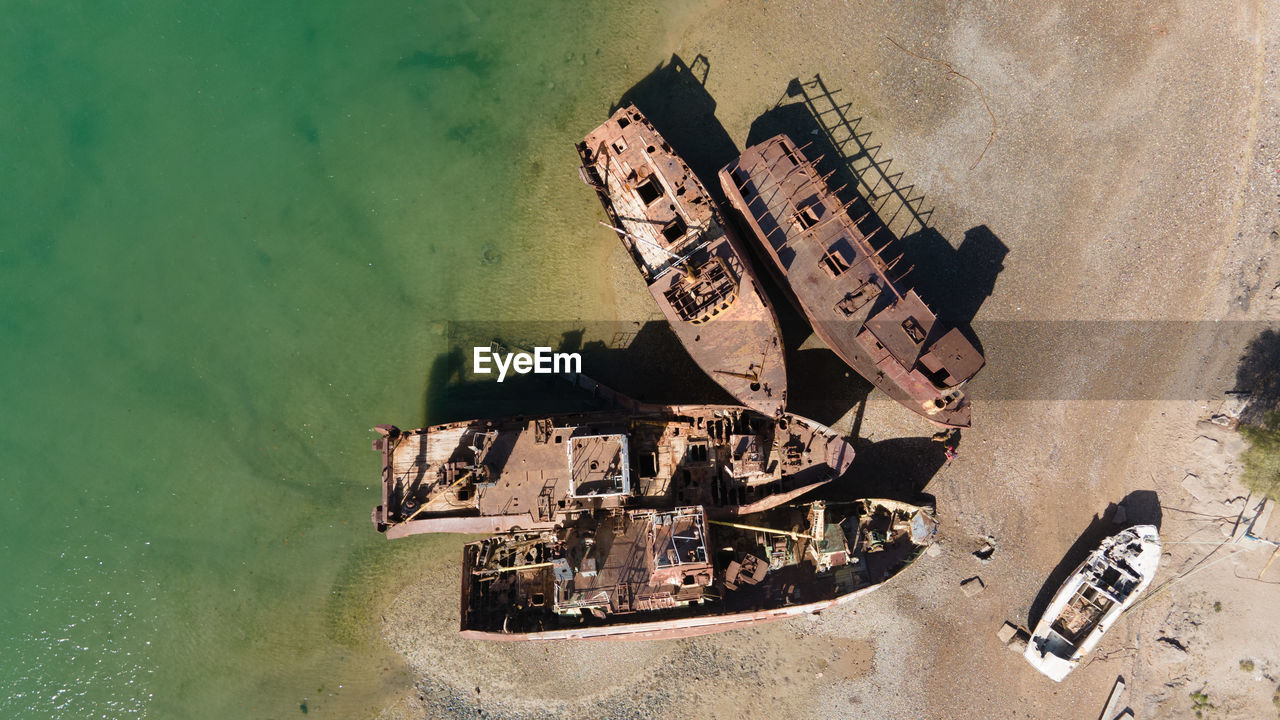 High angle view of old abandoned building by sea