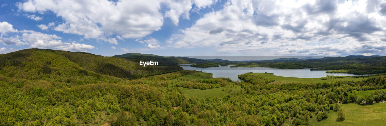 Amazing huge aerial panorama from to green countryside and a lake