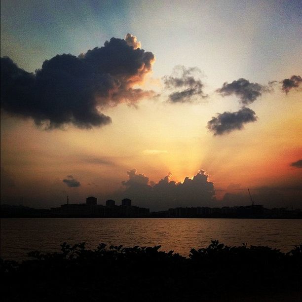 SCENIC VIEW OF SUNSET OVER SEA
