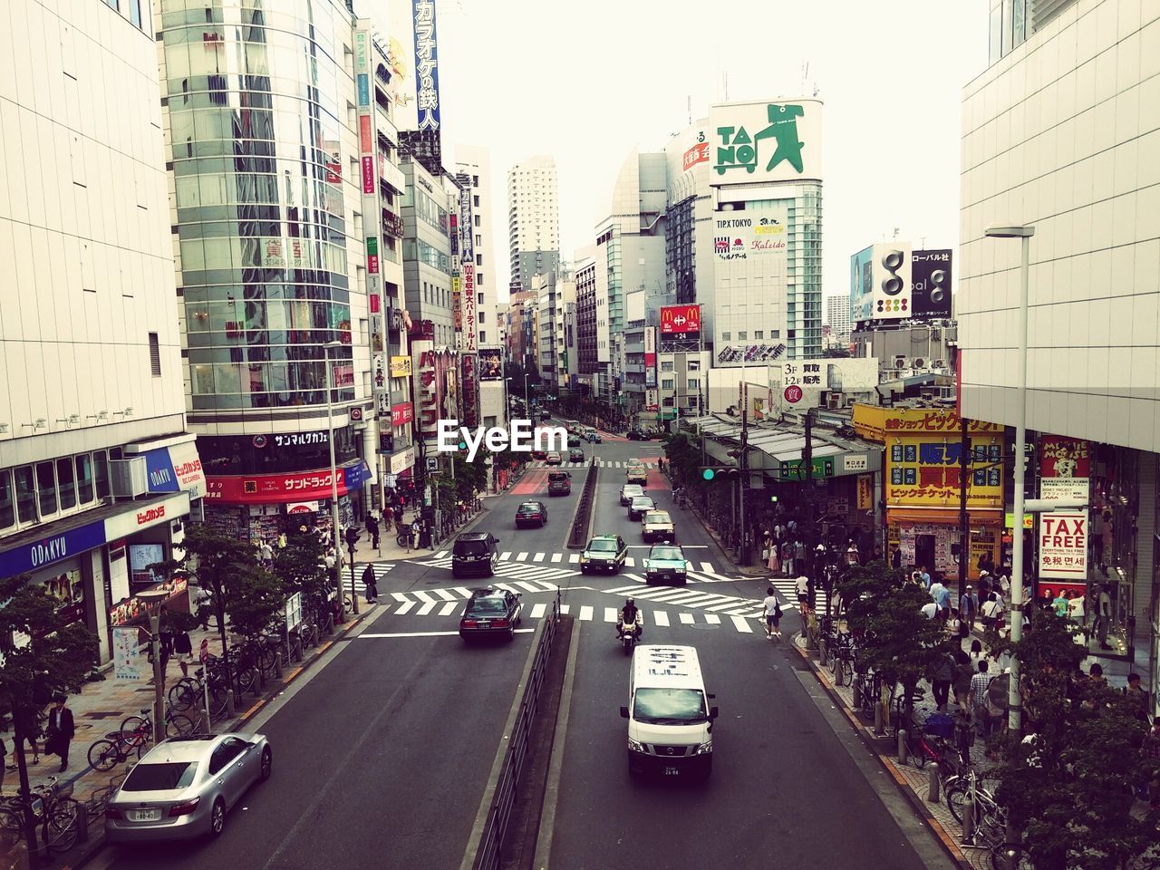 High angle view of people and cars on city street