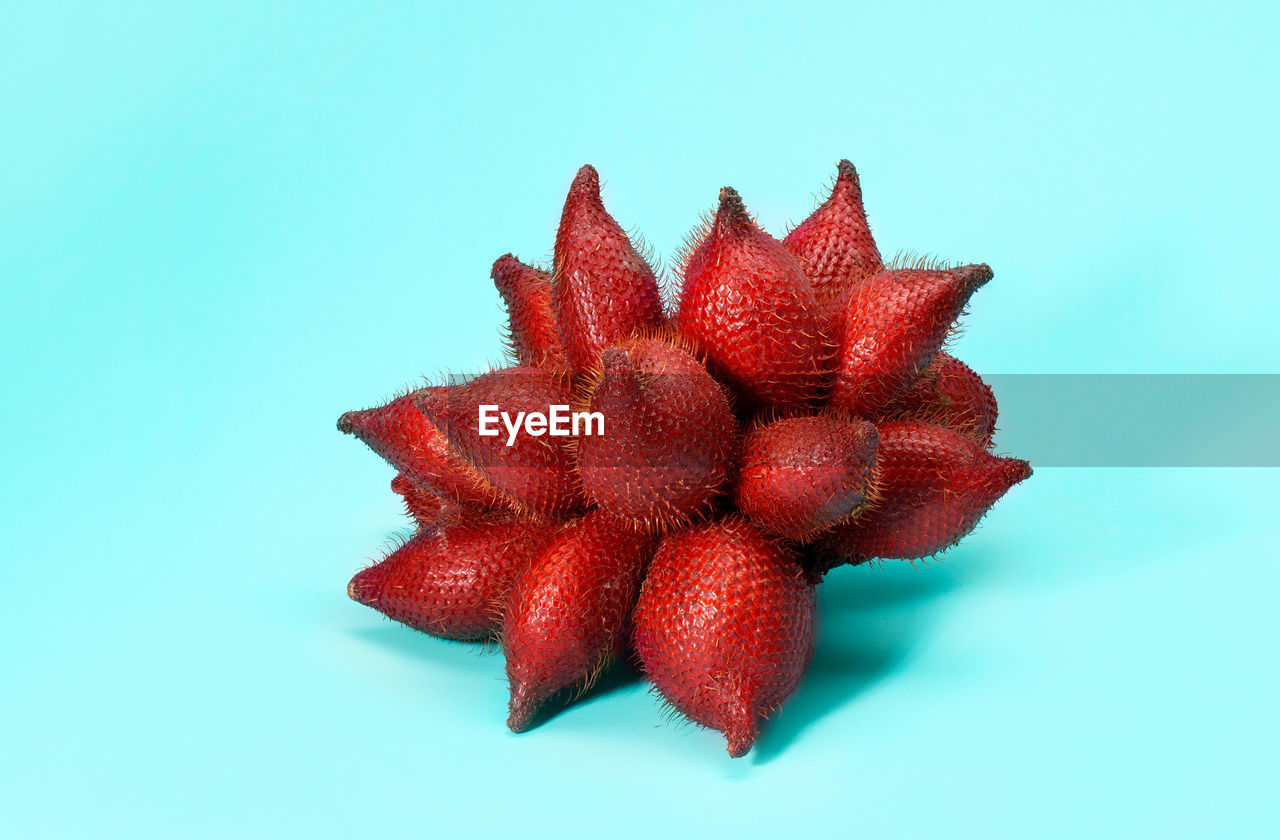 CLOSE-UP OF STRAWBERRY OVER BLACK BACKGROUND