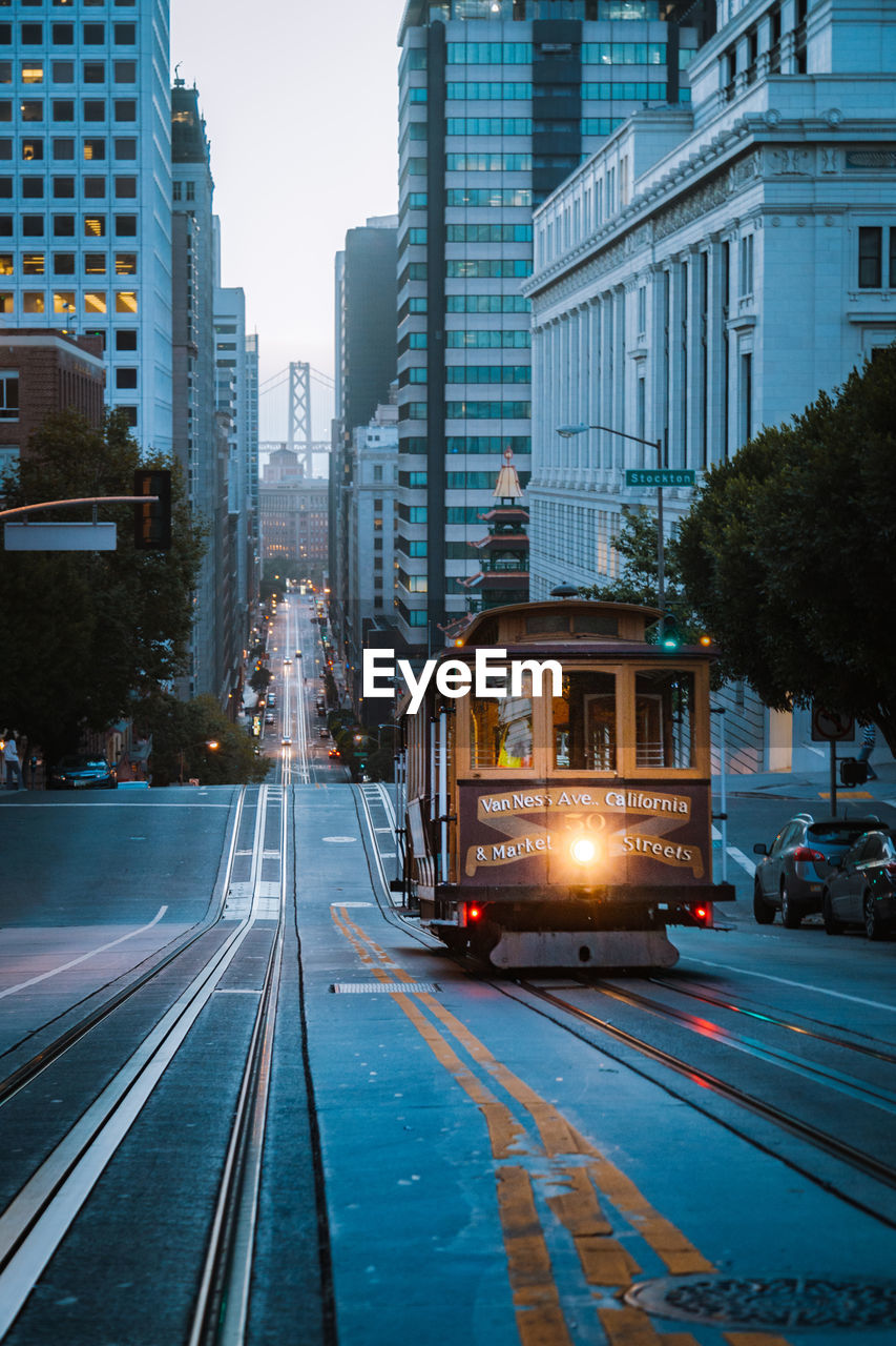 RAILROAD TRACKS AMIDST BUILDINGS IN CITY