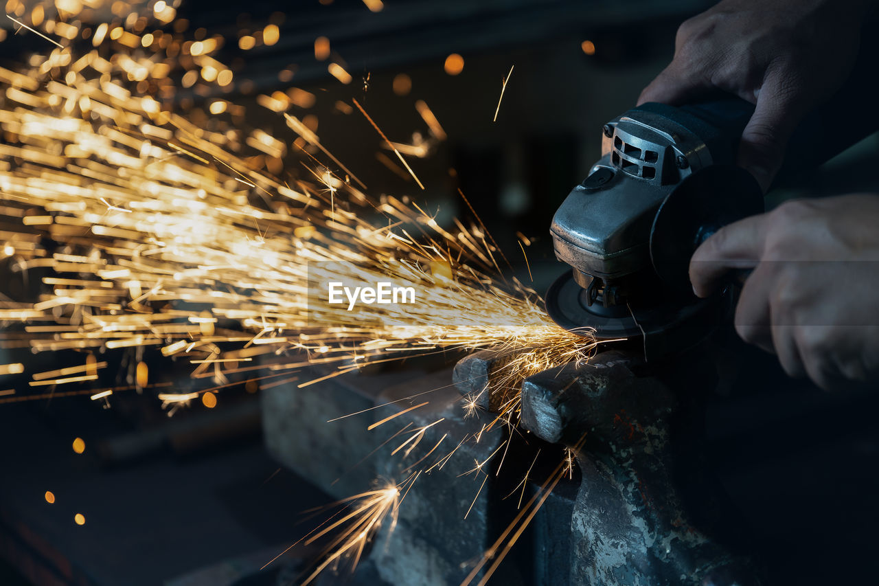 Cropped hands of man working at workshop