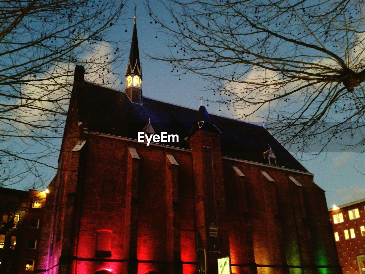 LOW ANGLE VIEW OF BUILDING AT NIGHT