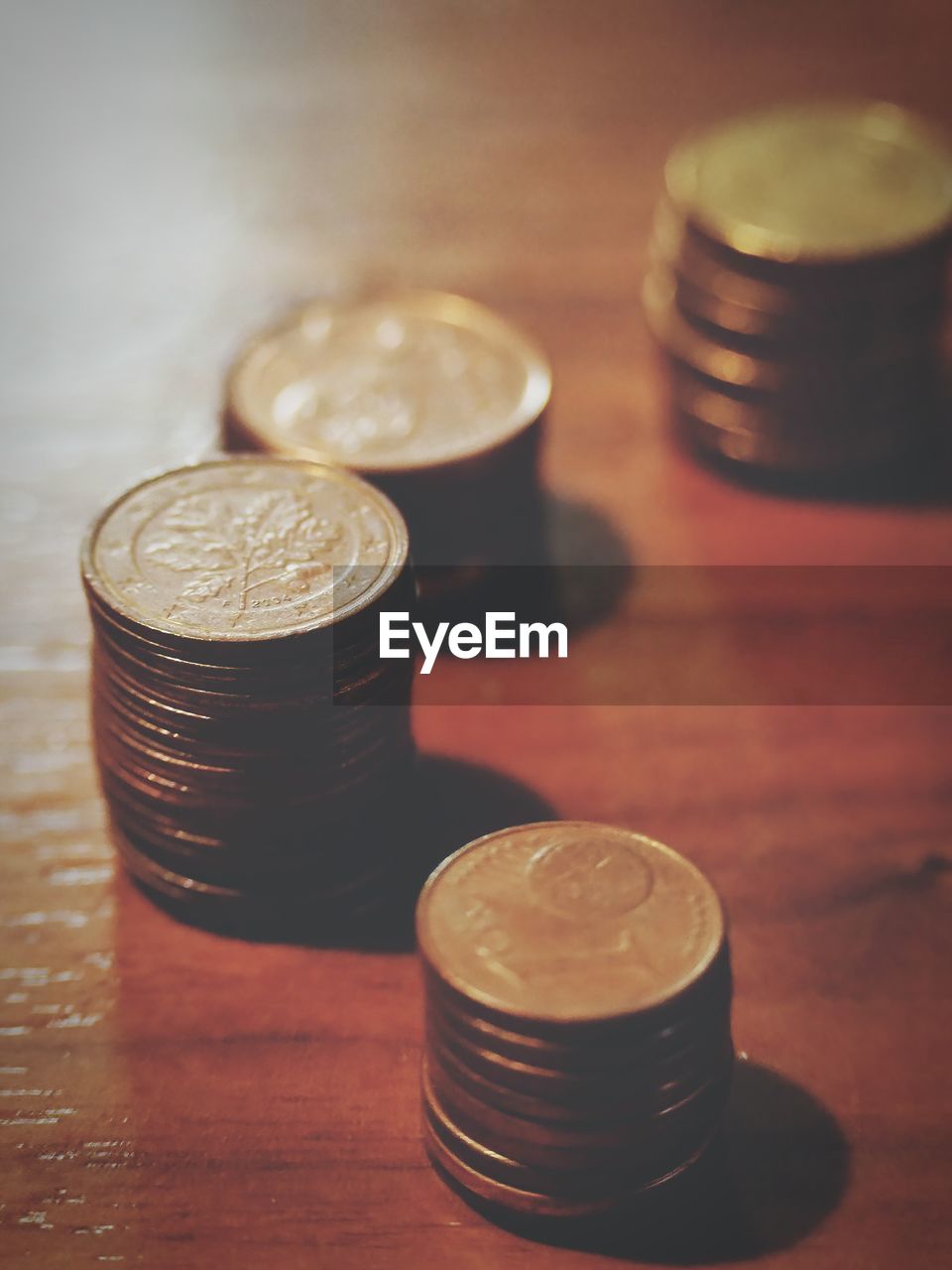 coin, finance, money, business, currency, indoors, table, close-up, wealth, no people, finance and economy, savings, still life, food and drink, wood, business finance and industry, focus on foreground