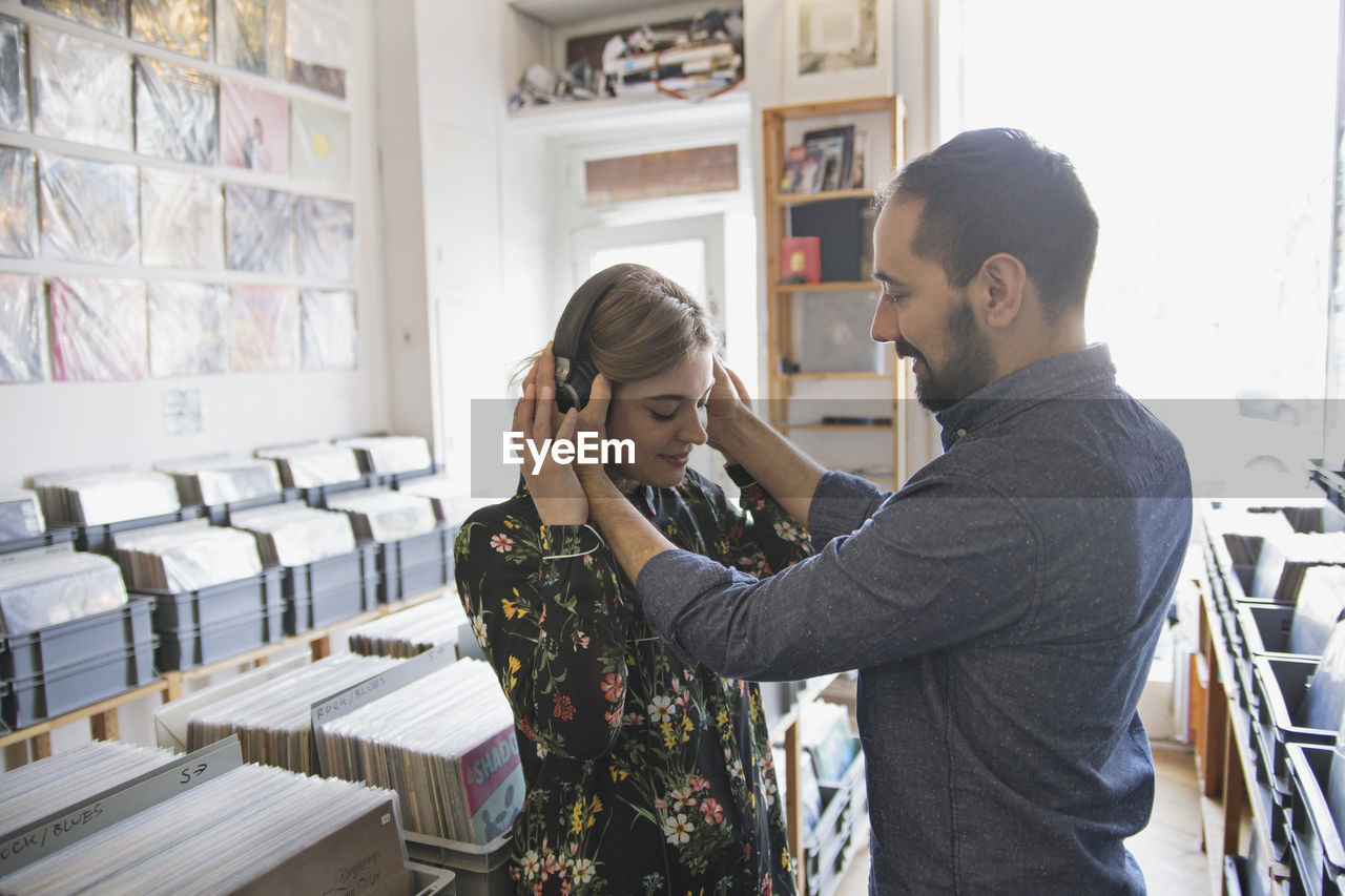 Young couple at record store