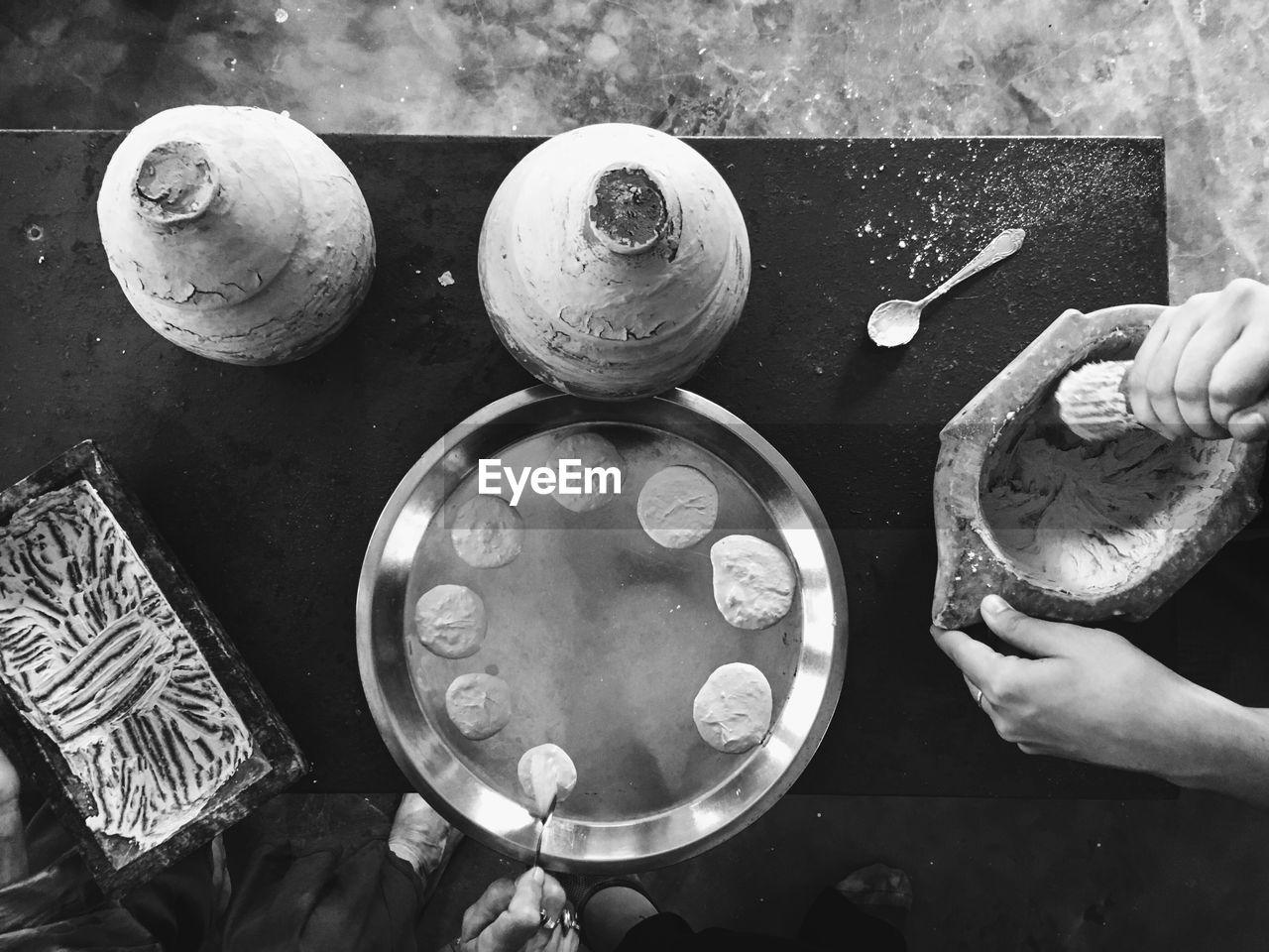 Cropped image of people preparing food on table