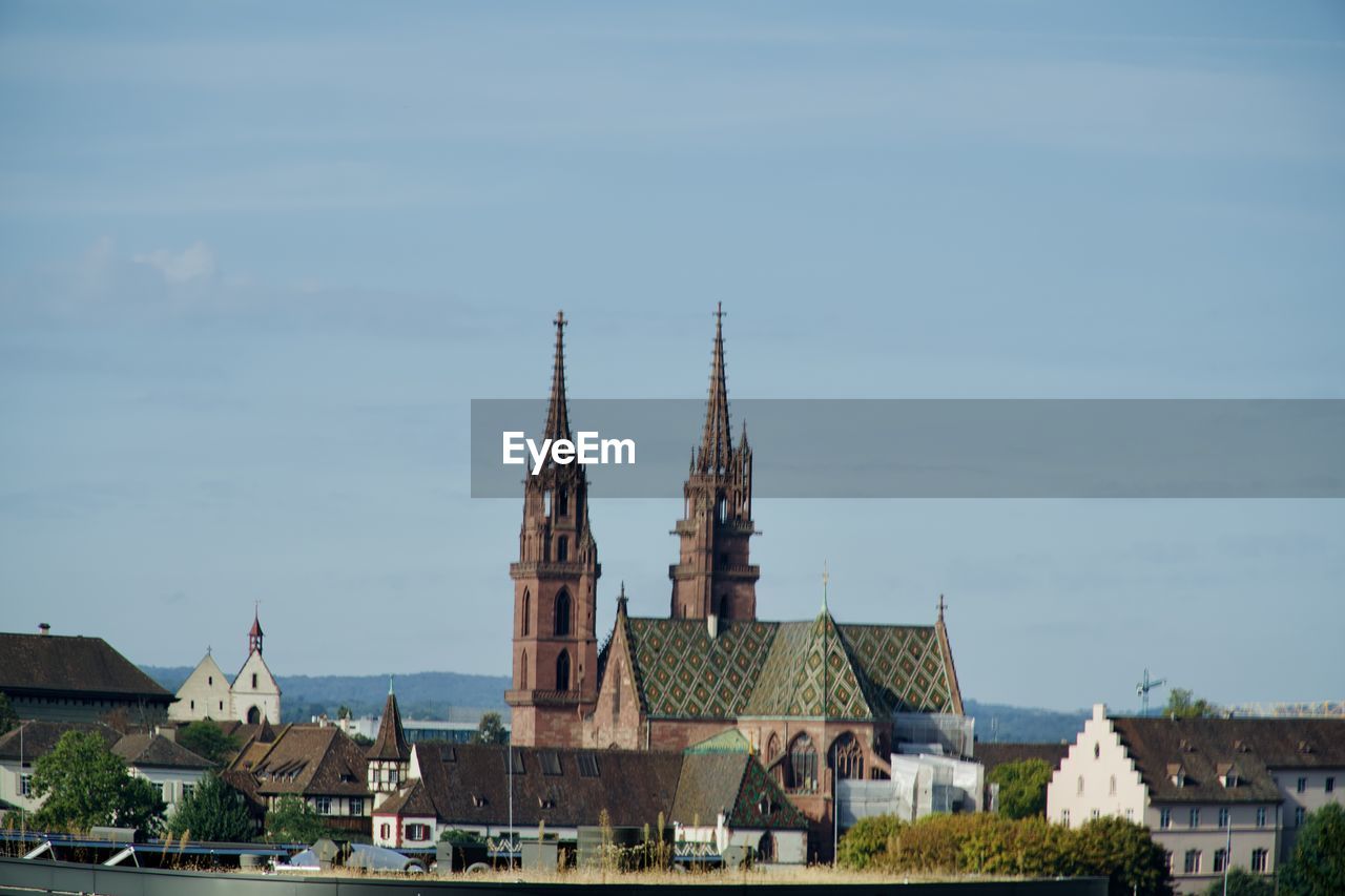 View of buildings in city against sky