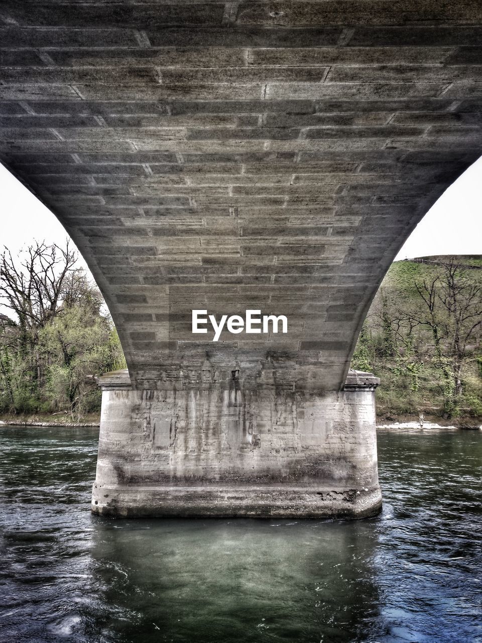 BELOW BRIDGE OVER RIVER