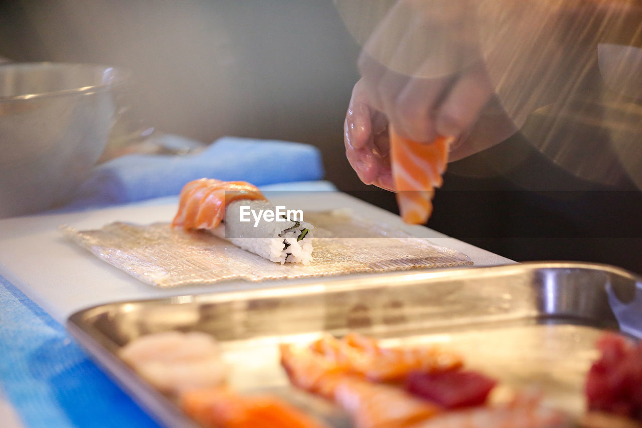 cropped hand of person preparing food