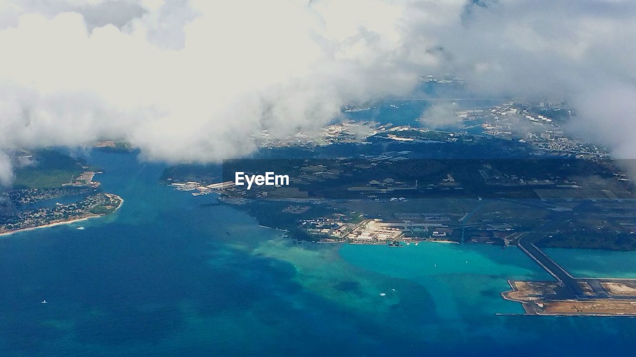 Aerial view of sea by landscape