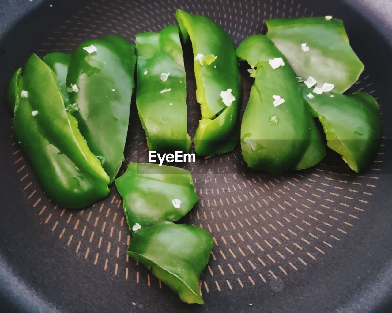 CLOSE-UP OF GREEN FRUITS ON TABLE