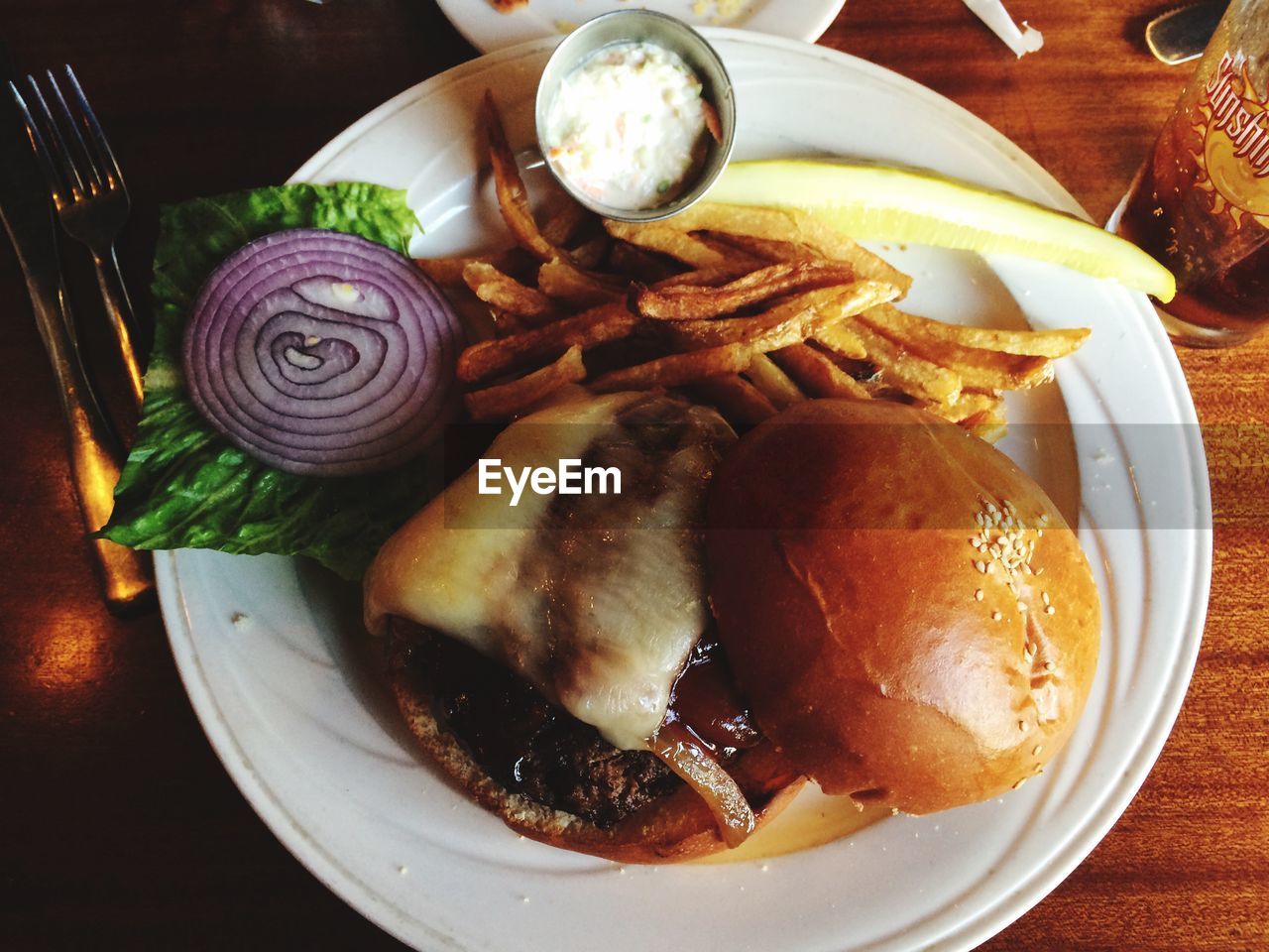 Close-up high angle view of fries with burger