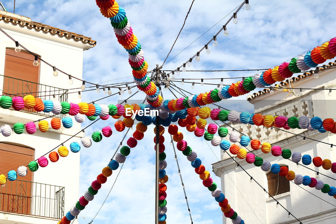 Low angle view of multi colored decorations against sky
