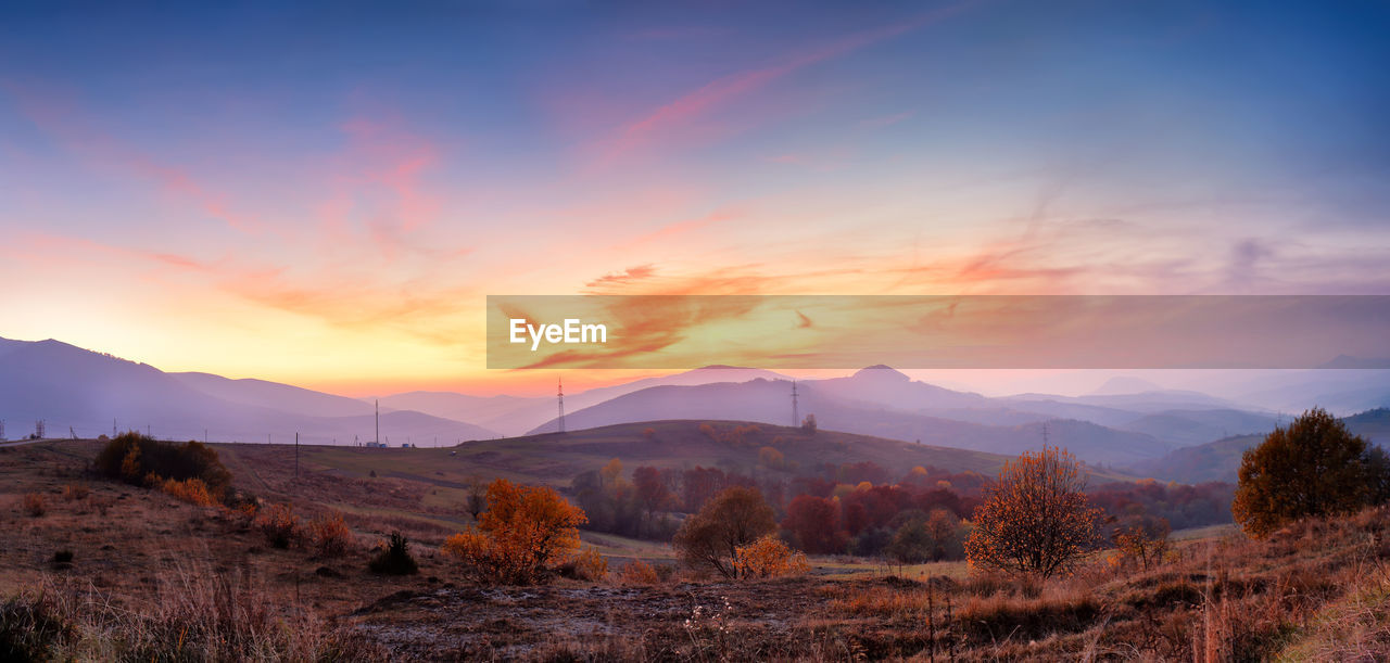 Scenic view of mountains against sky during sunset