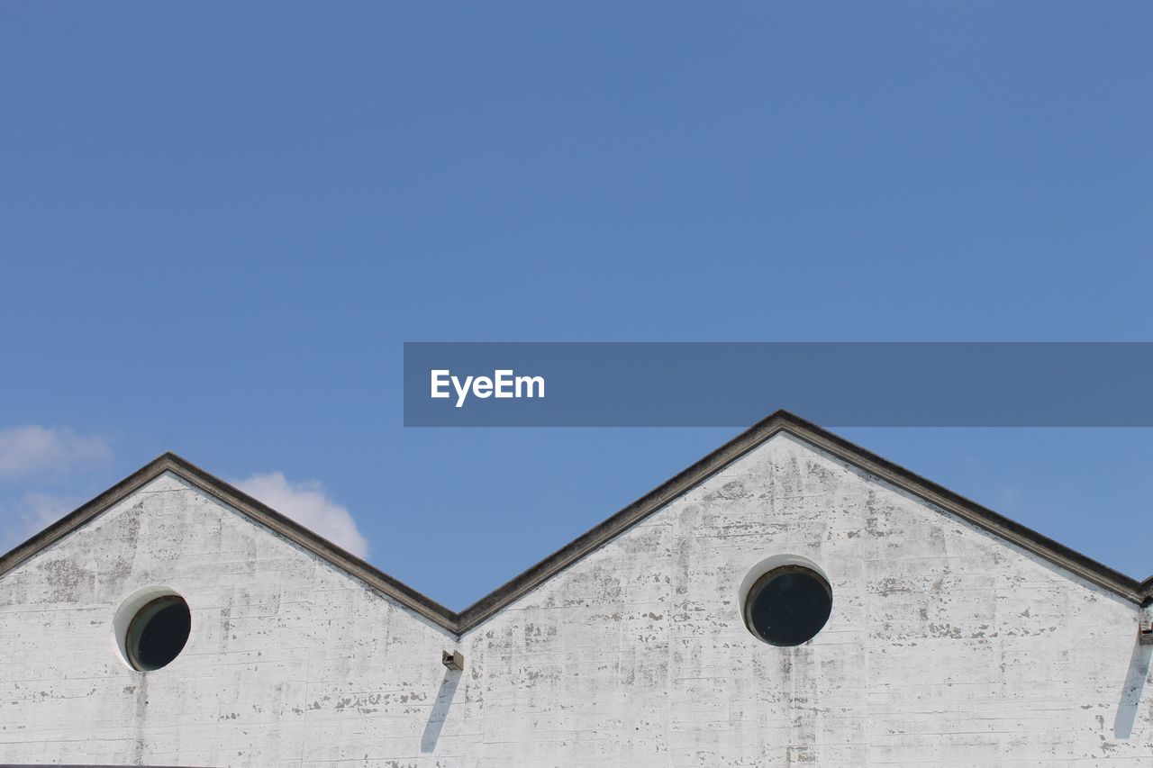 Low angle view of houses against sky