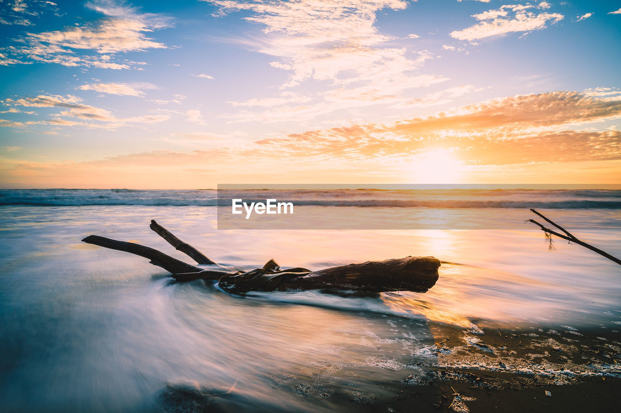 Scenic view of sea against sky during sunset