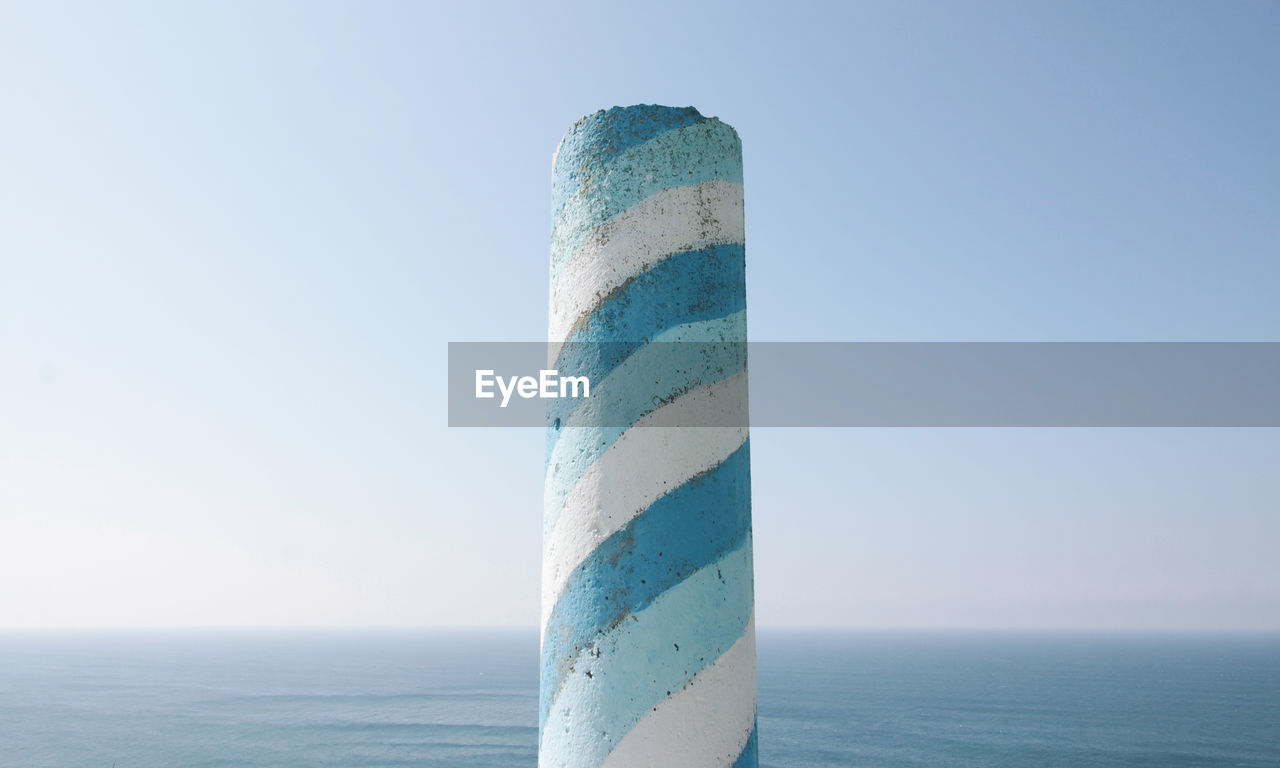 Low angle view of sea against clear sky