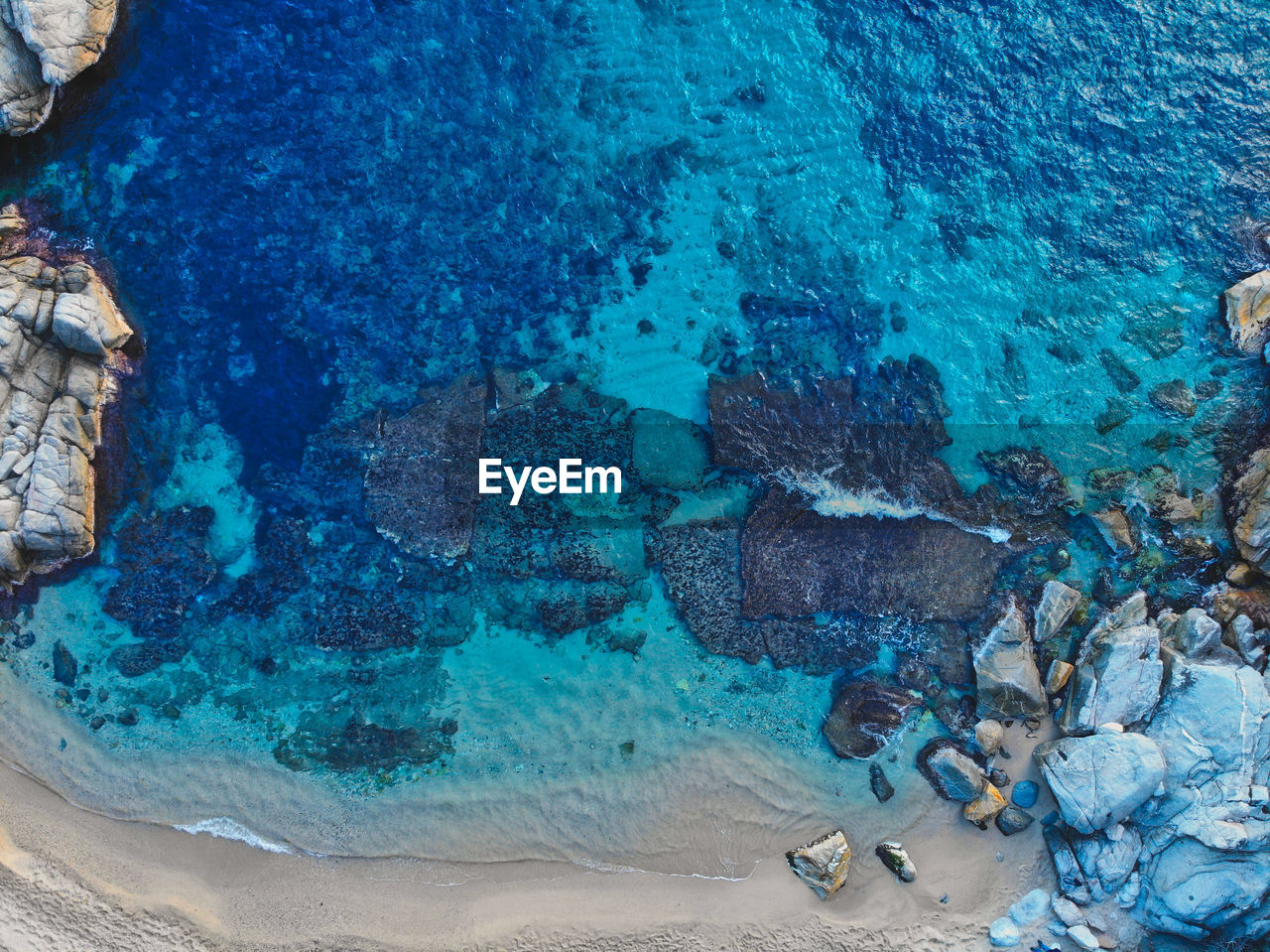 high angle view of rocks in sea