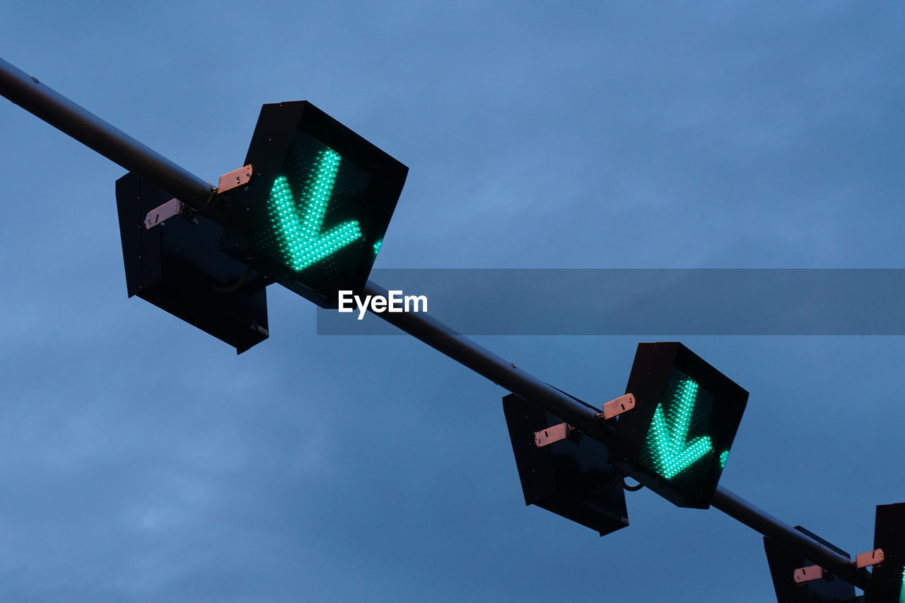 LOW ANGLE VIEW OF ROAD SIGN AGAINST BLUE SKY