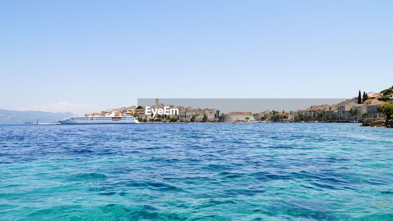 Scenic view of calm sea against clear blue sky