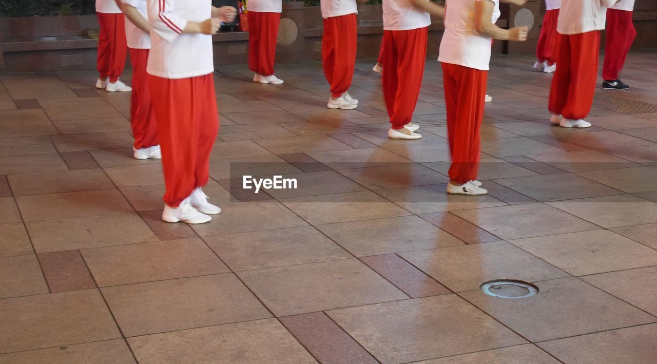 Low section of dancers performing on street