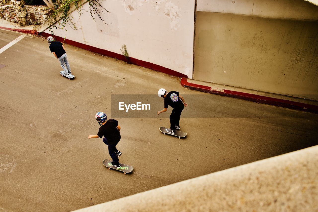 HIGH ANGLE VIEW OF BOYS PLAYING ON SOCCER