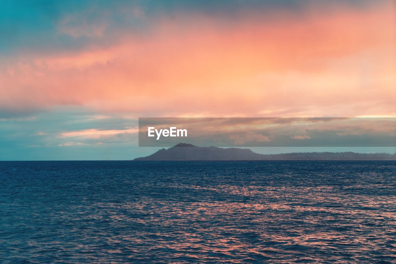 Scenic view of sea against sky during sunset