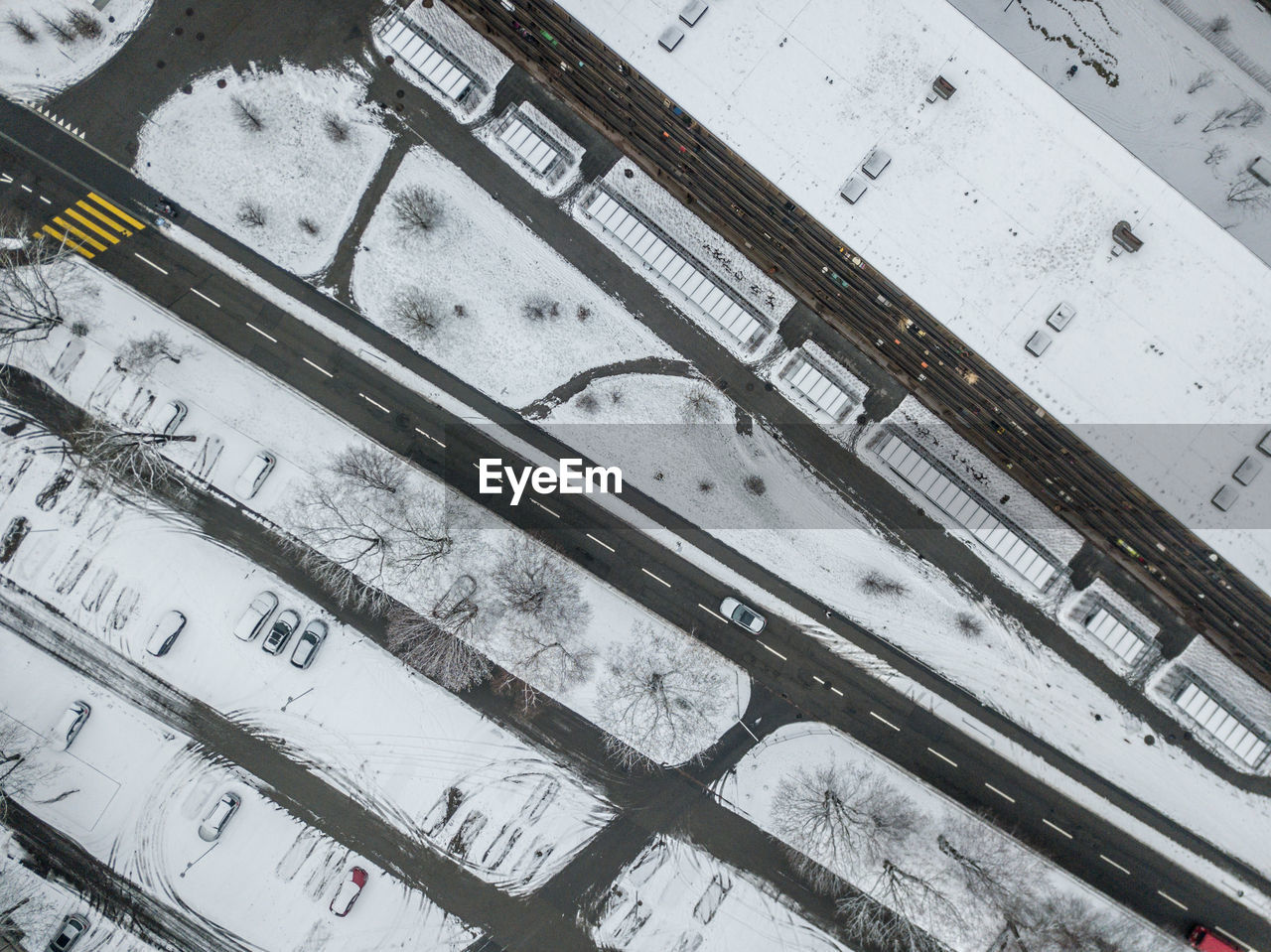 HIGH ANGLE VIEW OF SNOW ON RAILROAD TRACKS
