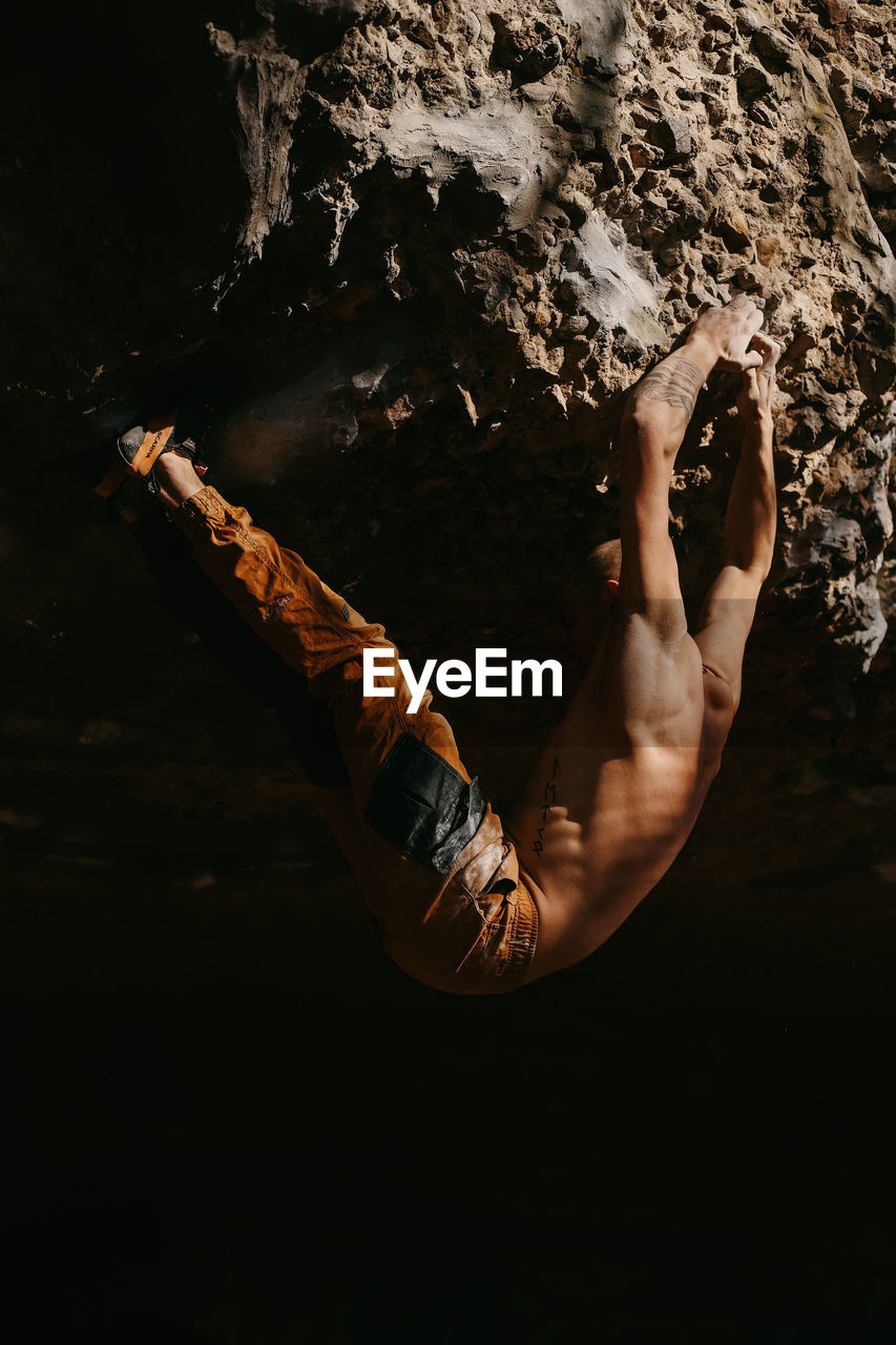 High angle view of man standing on rock