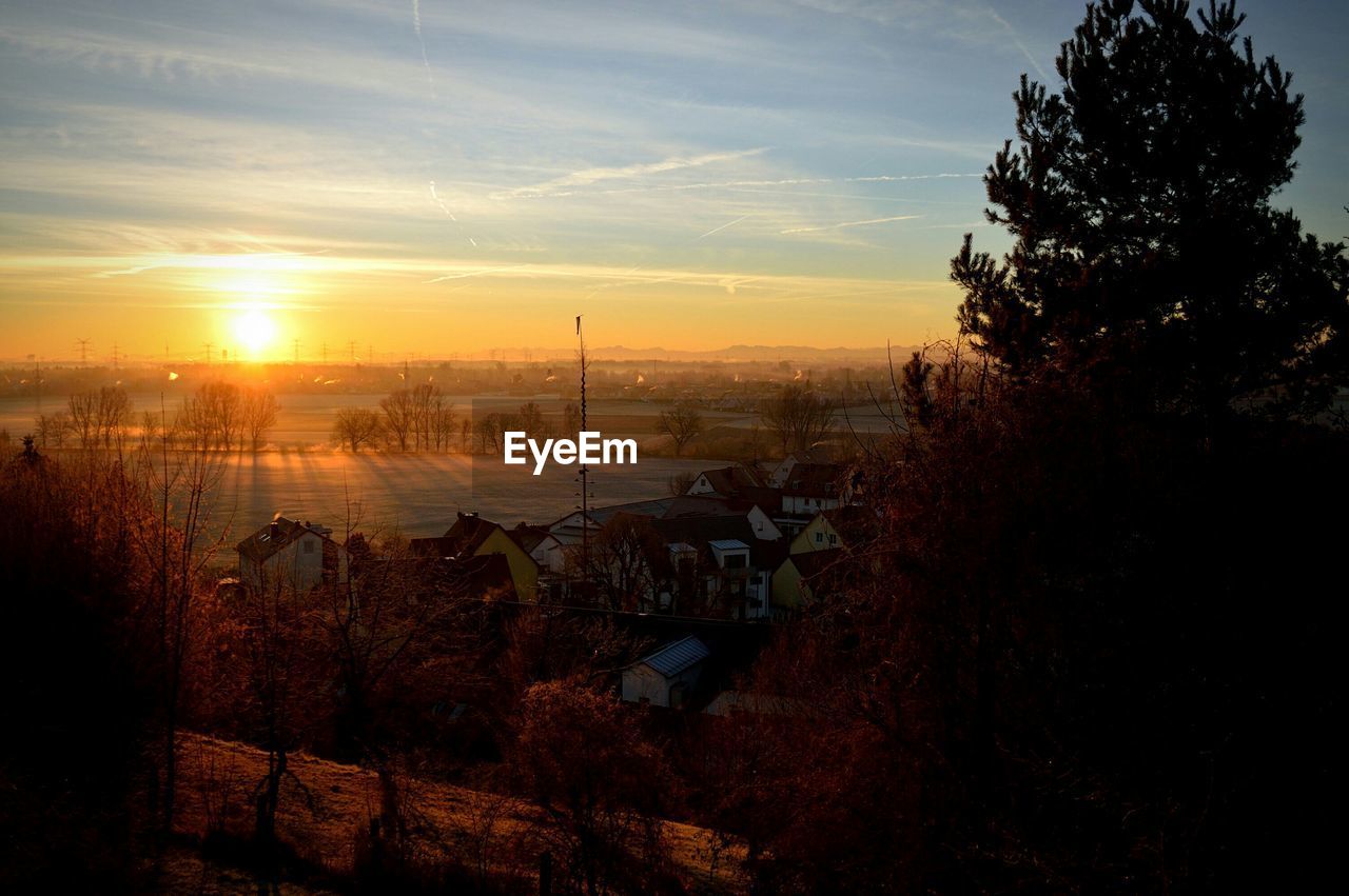 Scenic view of river at sunset