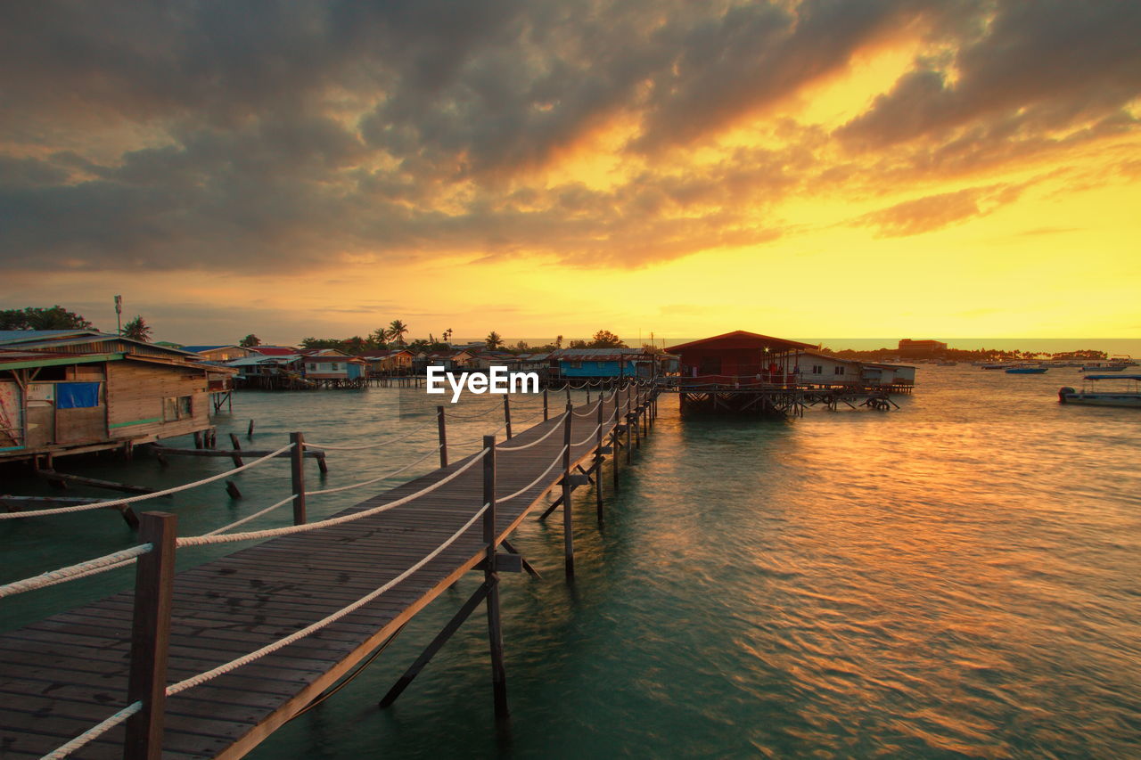 SCENIC VIEW OF SEA AGAINST ORANGE SKY