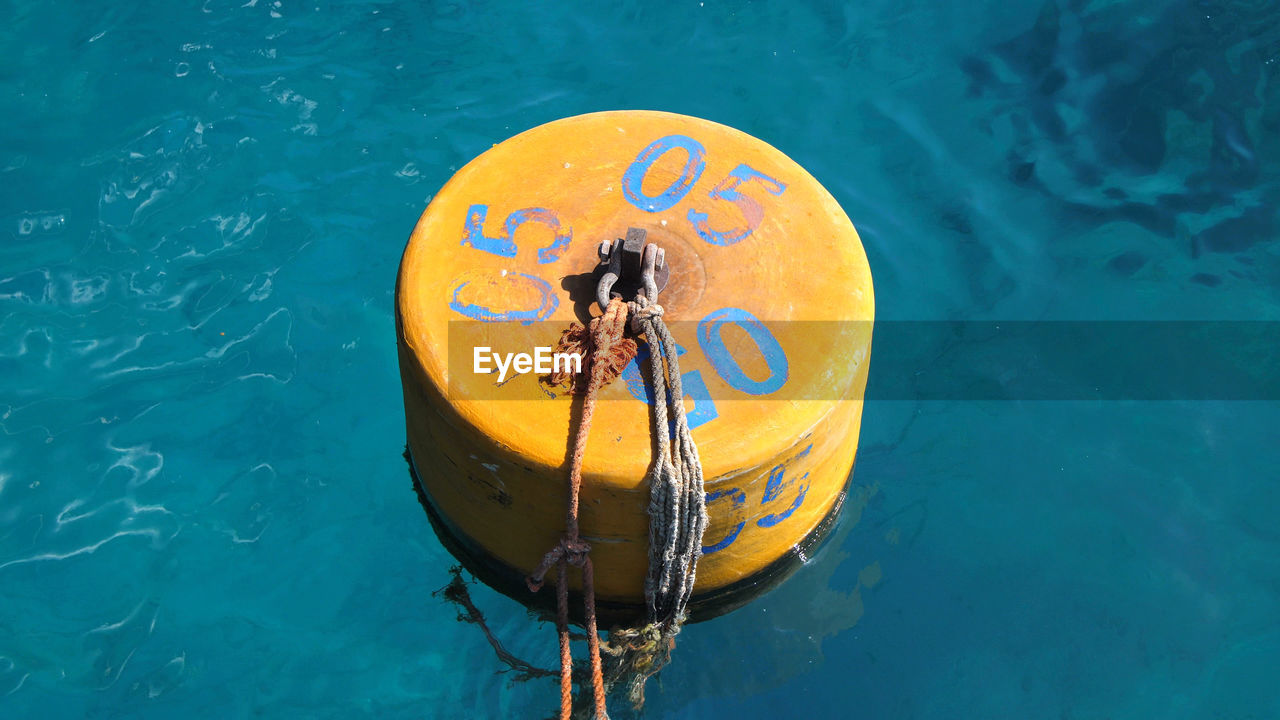 water, blue, nature, water sports, high angle view, nautical vessel, yellow, day, transportation, sea, no people, outdoors, buoy, floating on water, swimming, floating, protection