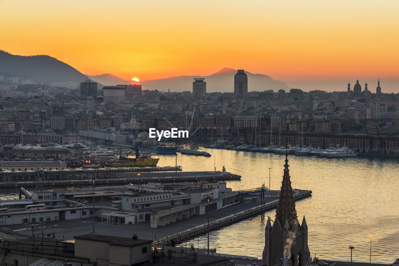 View of genoa up to portofino promontory at dawn