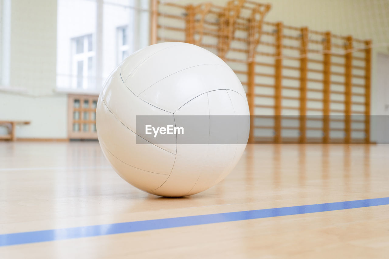 Close-up of on volleyball on court