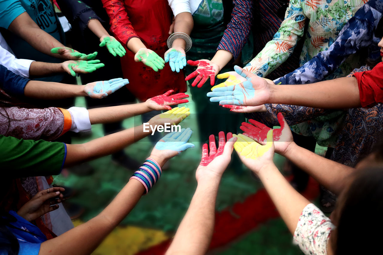 High angle view of colorful hands