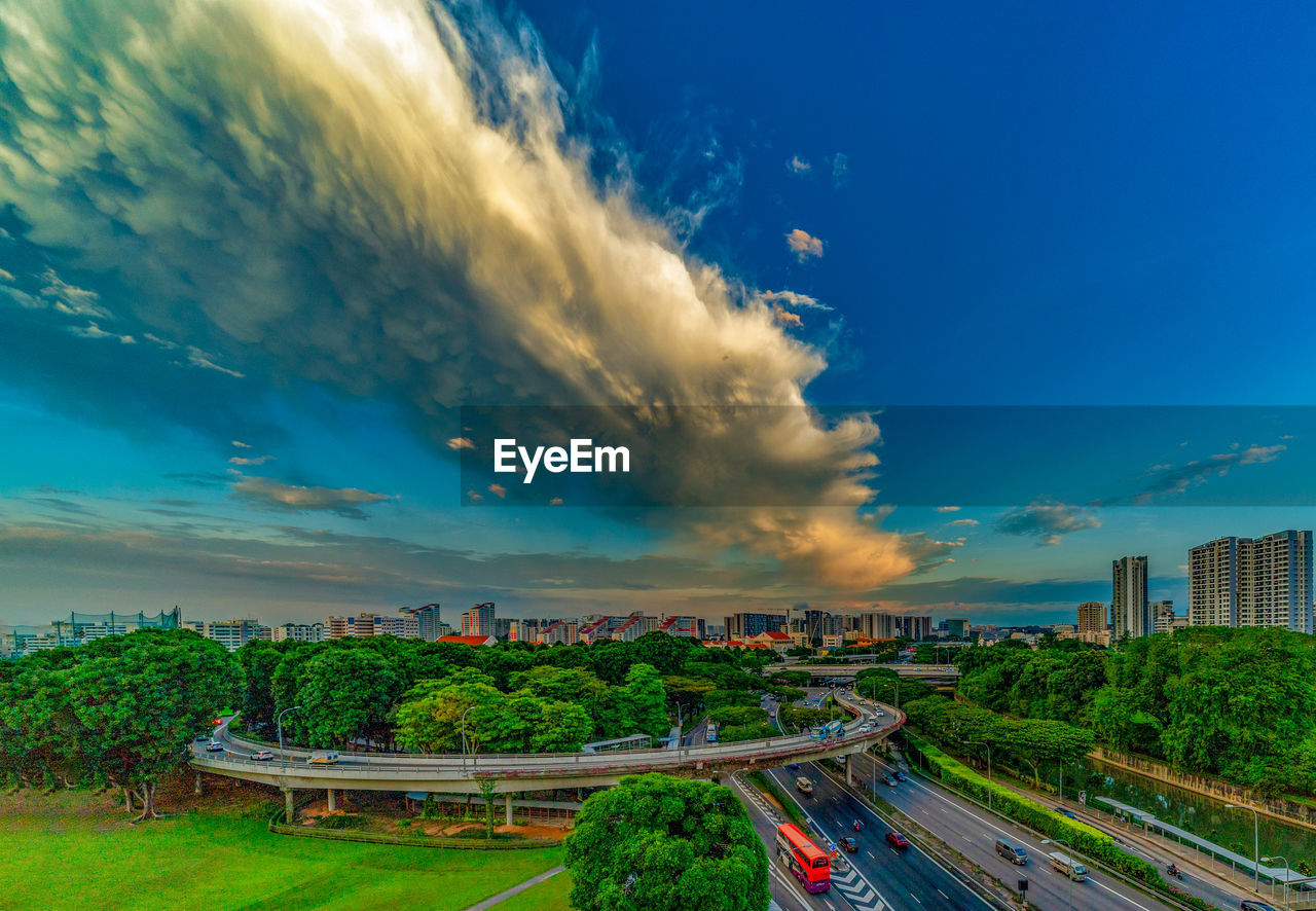 HIGH ANGLE VIEW OF ROAD AGAINST BLUE SKY