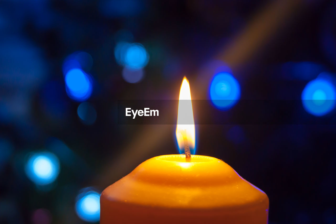 Close-up of illuminated candle