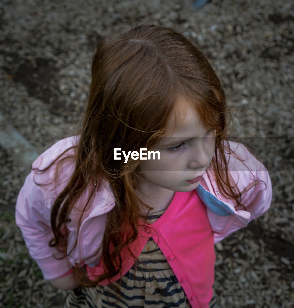 High angle view of girl looking away outdoors