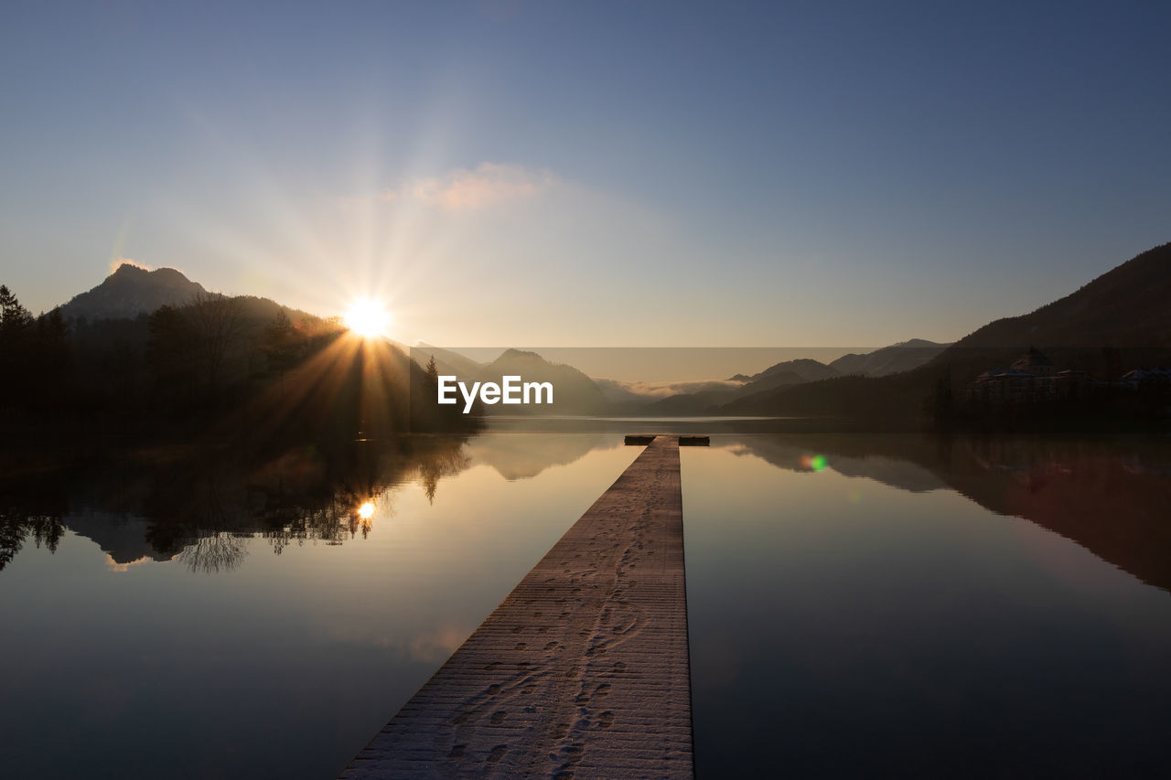 Fuschlsee in winter, wooden jetty, salzkammergut, austria.