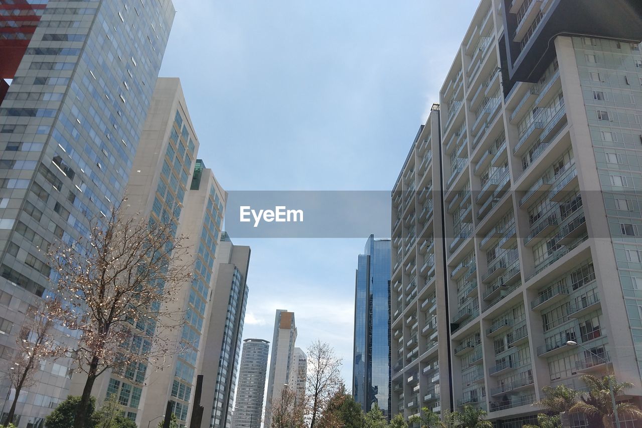 Low angle view of modern buildings against sky