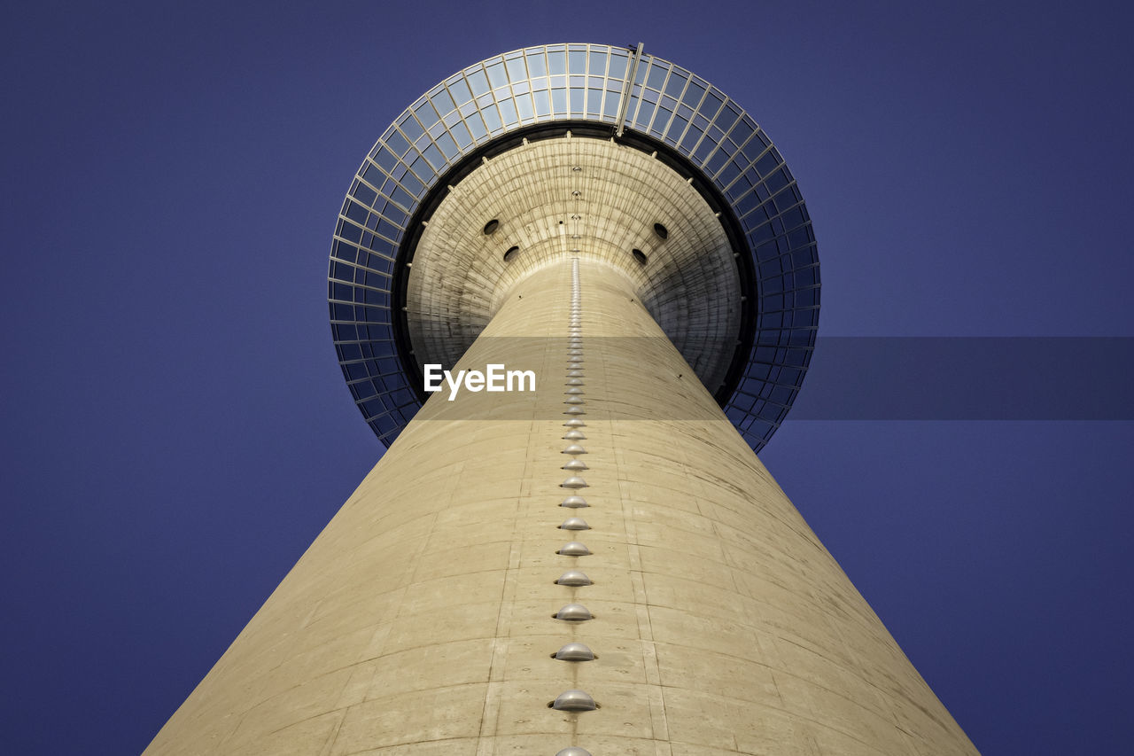 LOW ANGLE VIEW OF COMMUNICATIONS TOWER AGAINST SKY