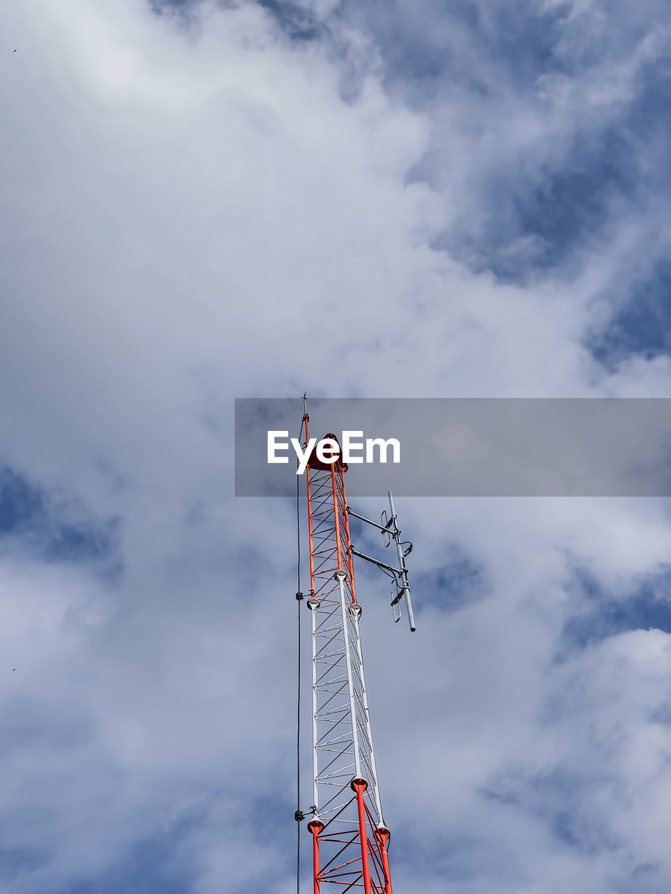 Low angle view of communications tower against sky