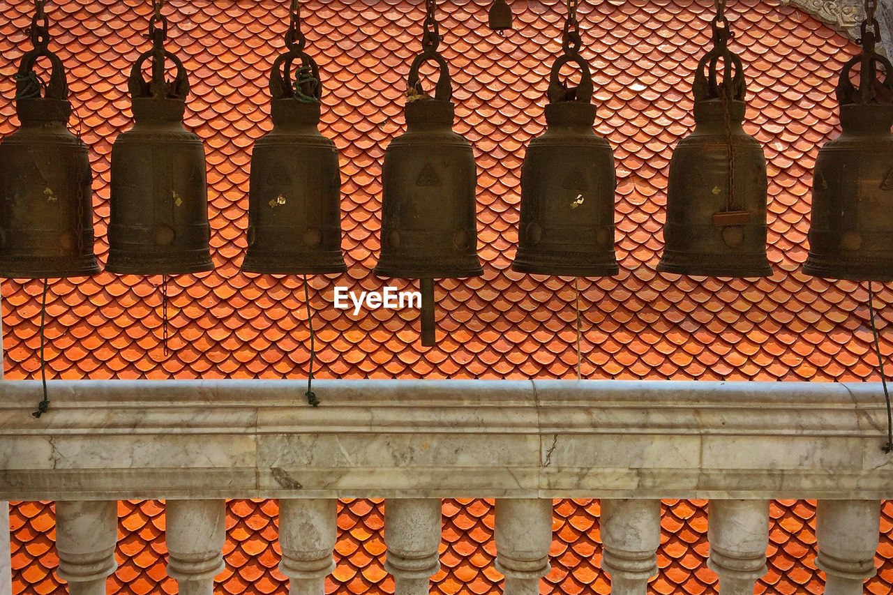 Close-up of hanging bells