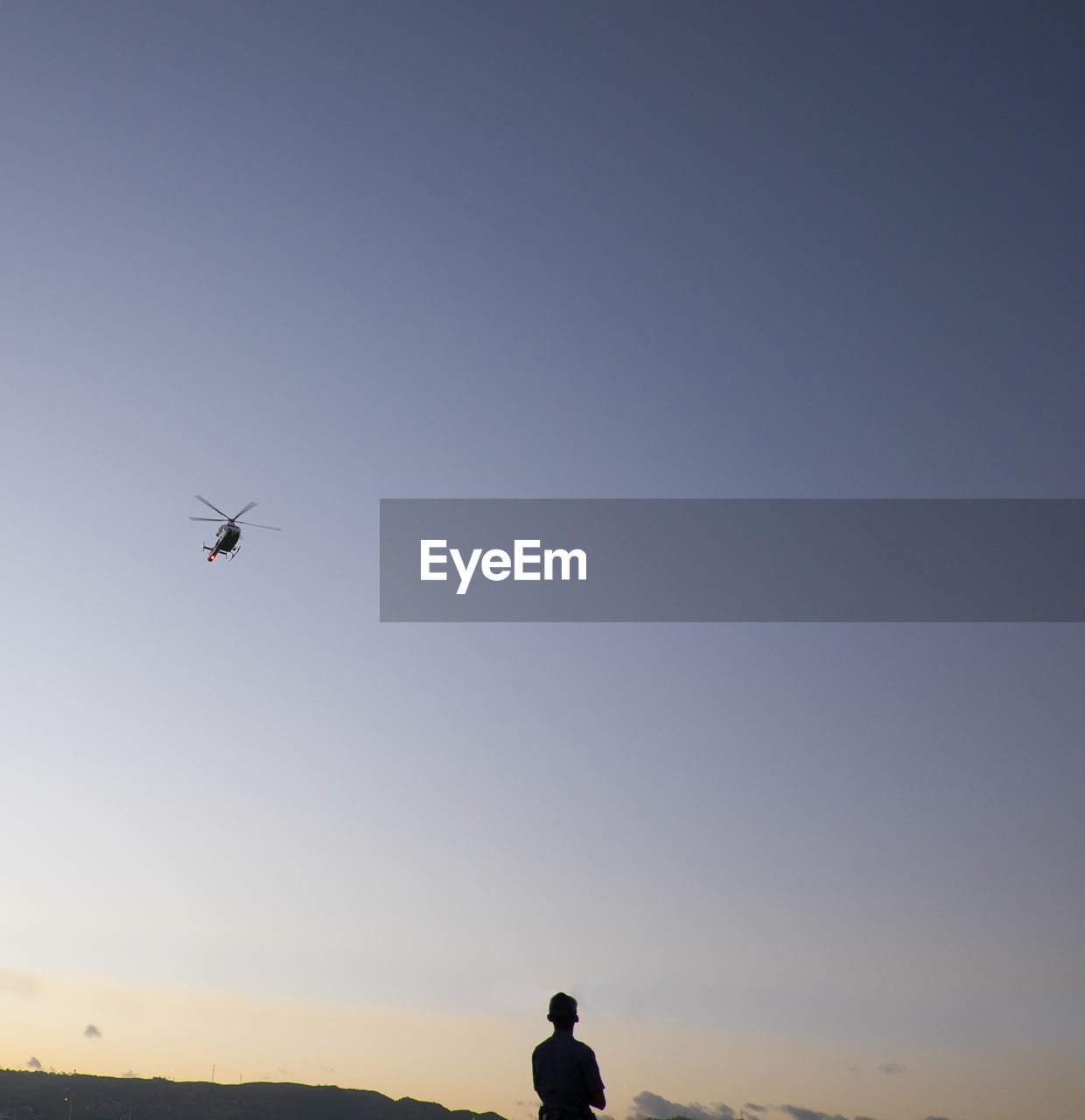 LOW ANGLE VIEW OF AIRPLANE FLYING IN SKY