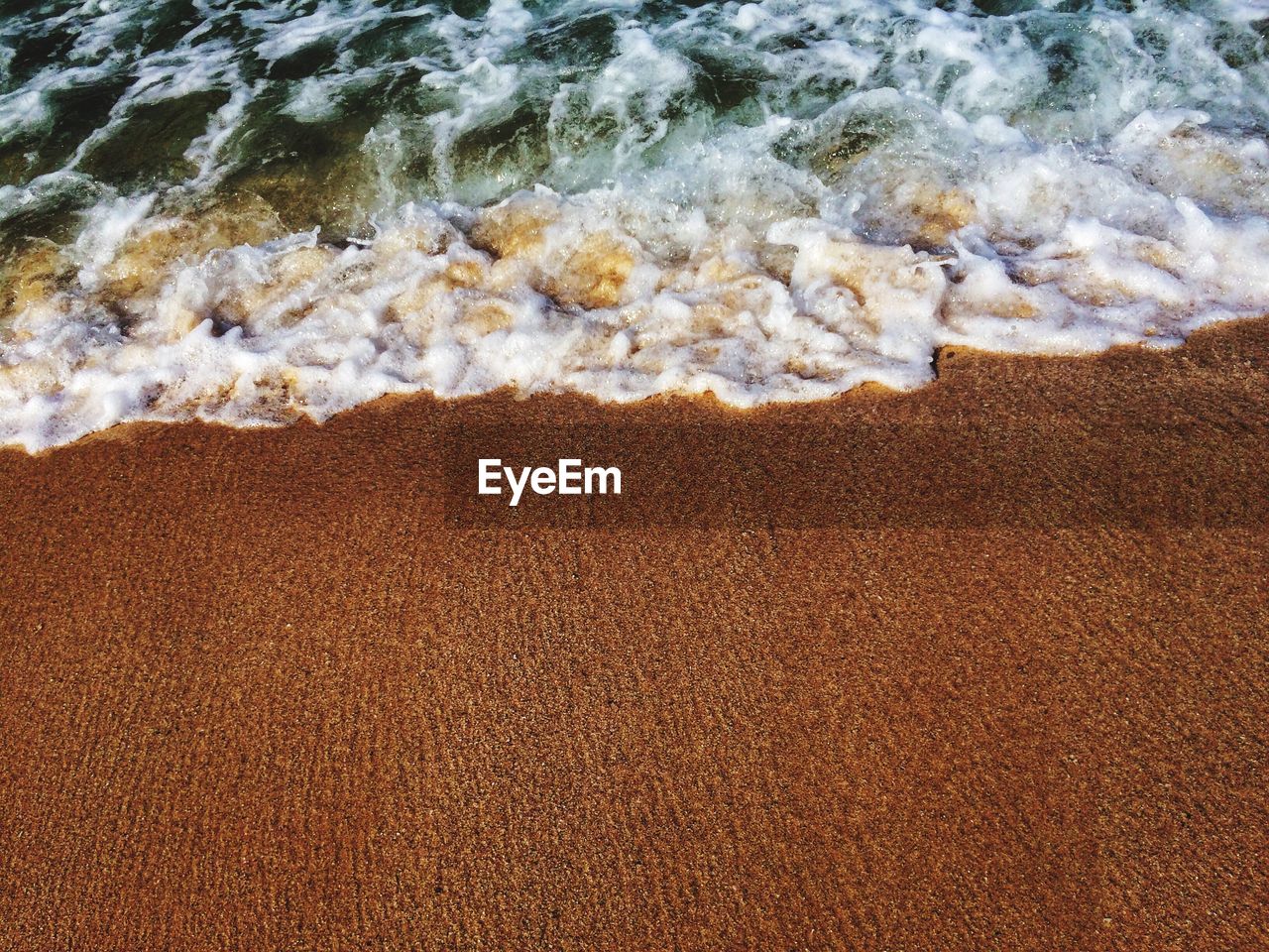 Wave reaching shore at beach