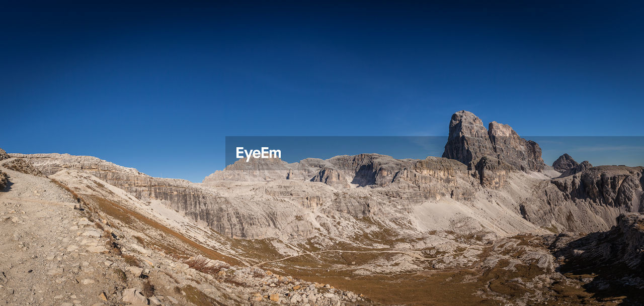 Awesome dolomitic panorama of tre scarperi and torre toblin peaks, south tyrol, italy