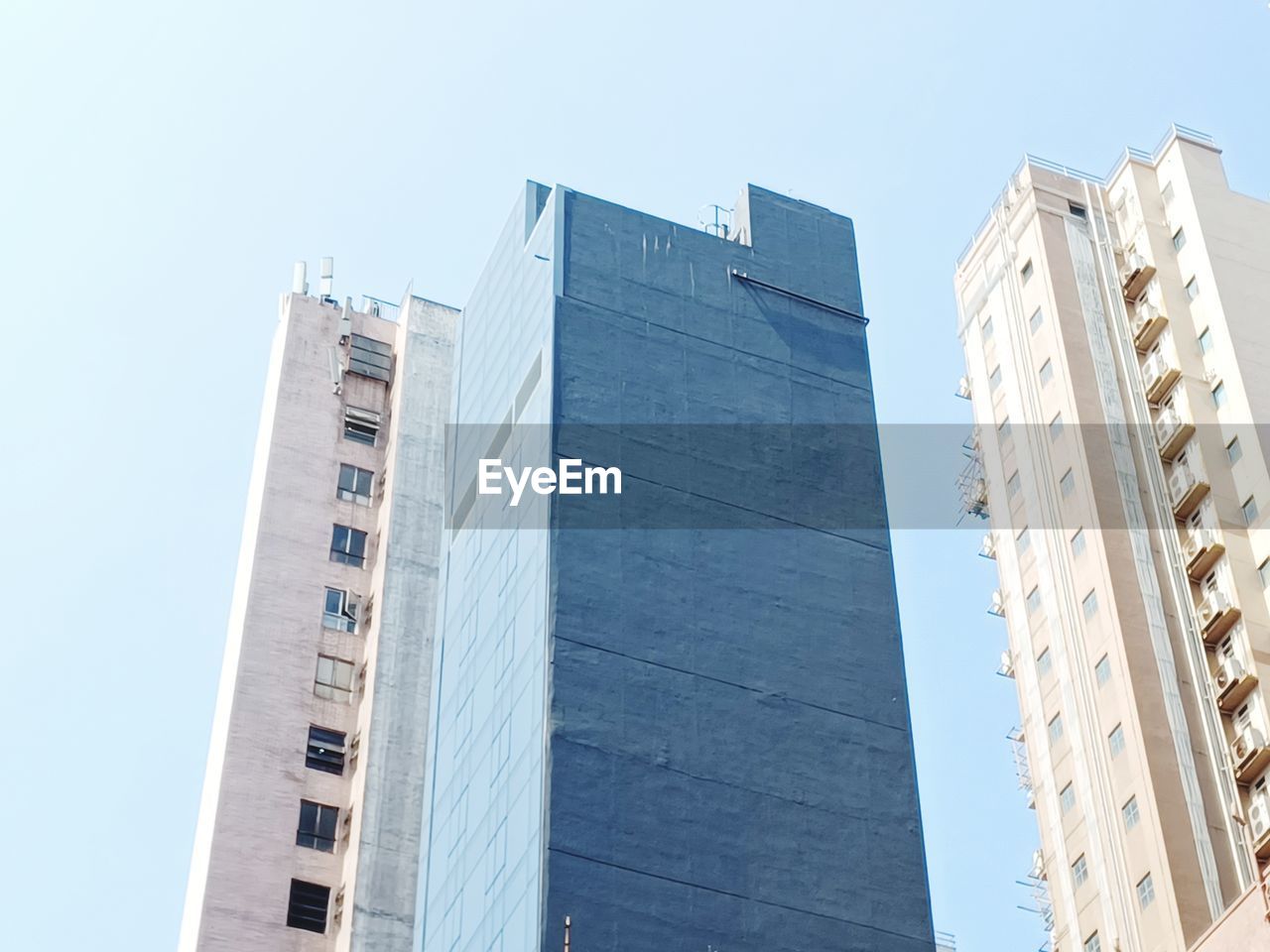 architecture, building exterior, built structure, tower block, building, skyscraper, city, office building exterior, sky, business, office, low angle view, downtown, tower, facade, no people, residential district, landmark, nature, window, blue, clear sky, condominium, day, urban area, finance, outdoors, construction industry, metropolitan area, business finance and industry