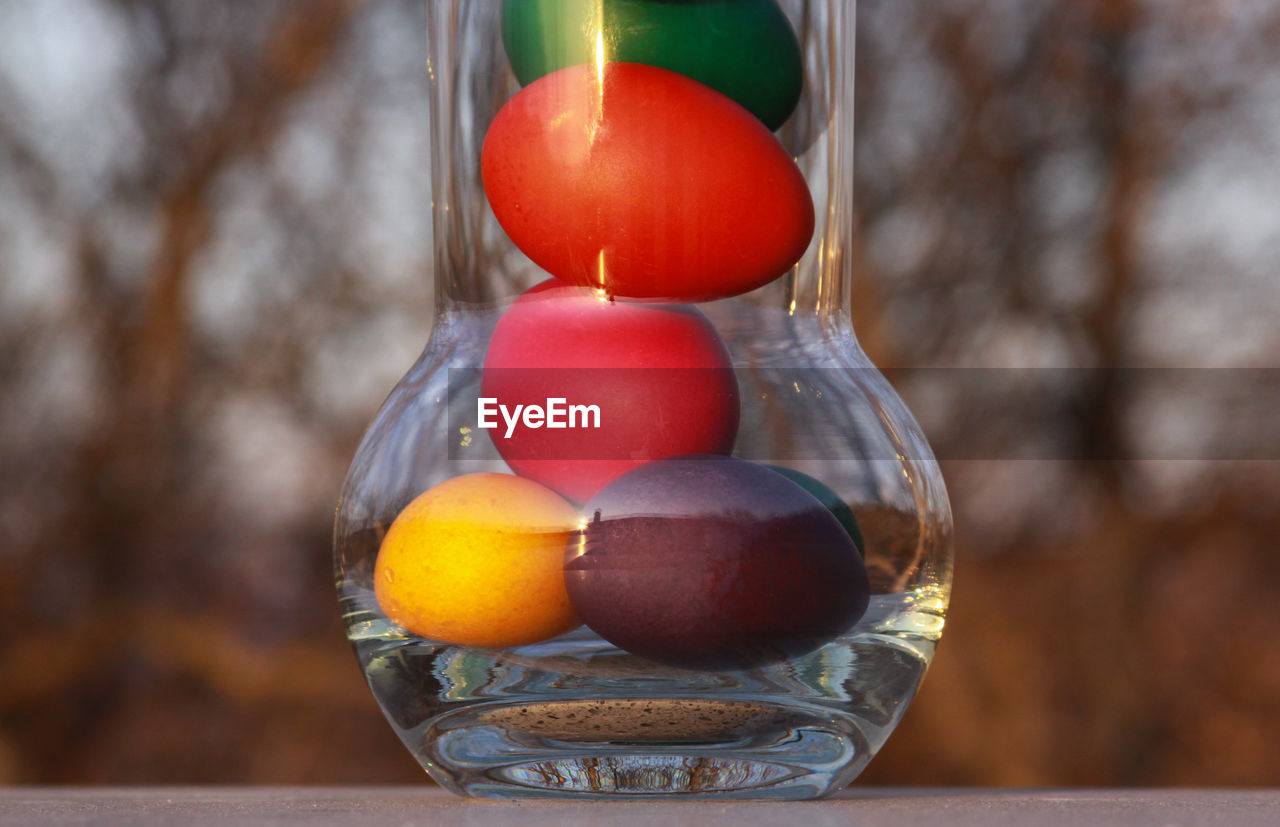 CLOSE-UP OF FRUITS IN GLASS CONTAINER